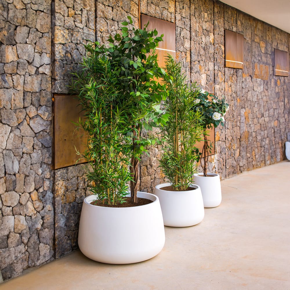Camelia from Newgarden: Where sophistication meets durability. These premium pots offer ample planting space and withstand extreme weather.