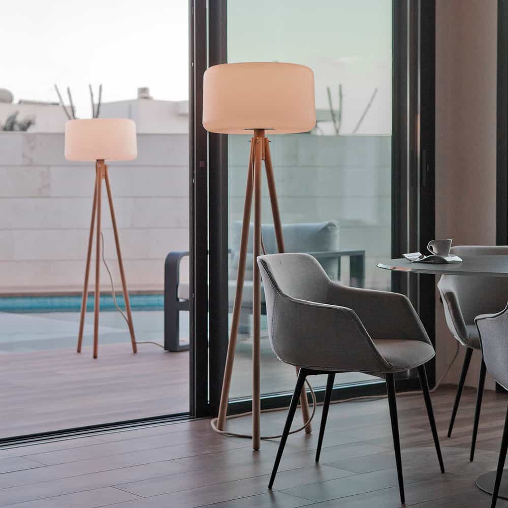 Elevate your space with Newgarden's Chloe lamp, a chic decor piece with wooden accents and adjustable settings.