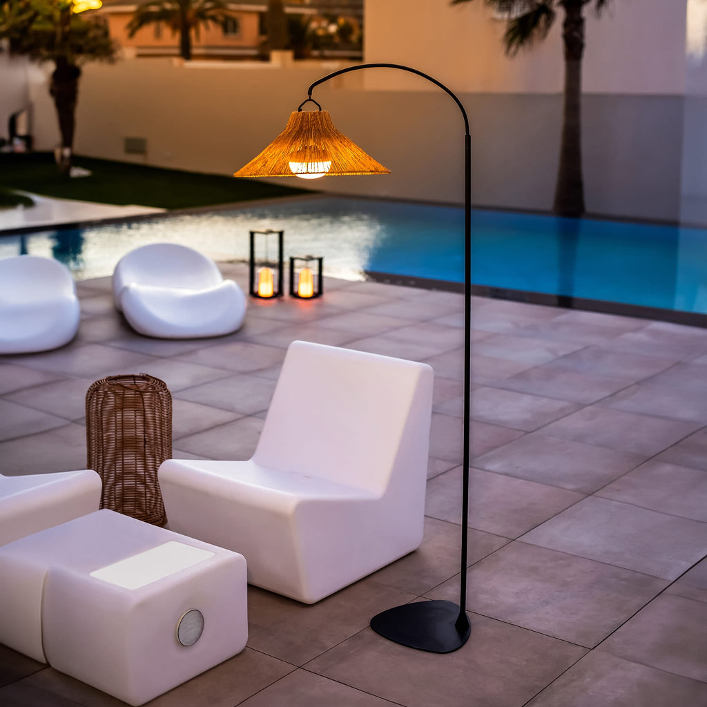 Discover Niza: a floor lamp that doubles as a wall lamp, featuring a hand-braided shade and a convenient magnetic bulb.